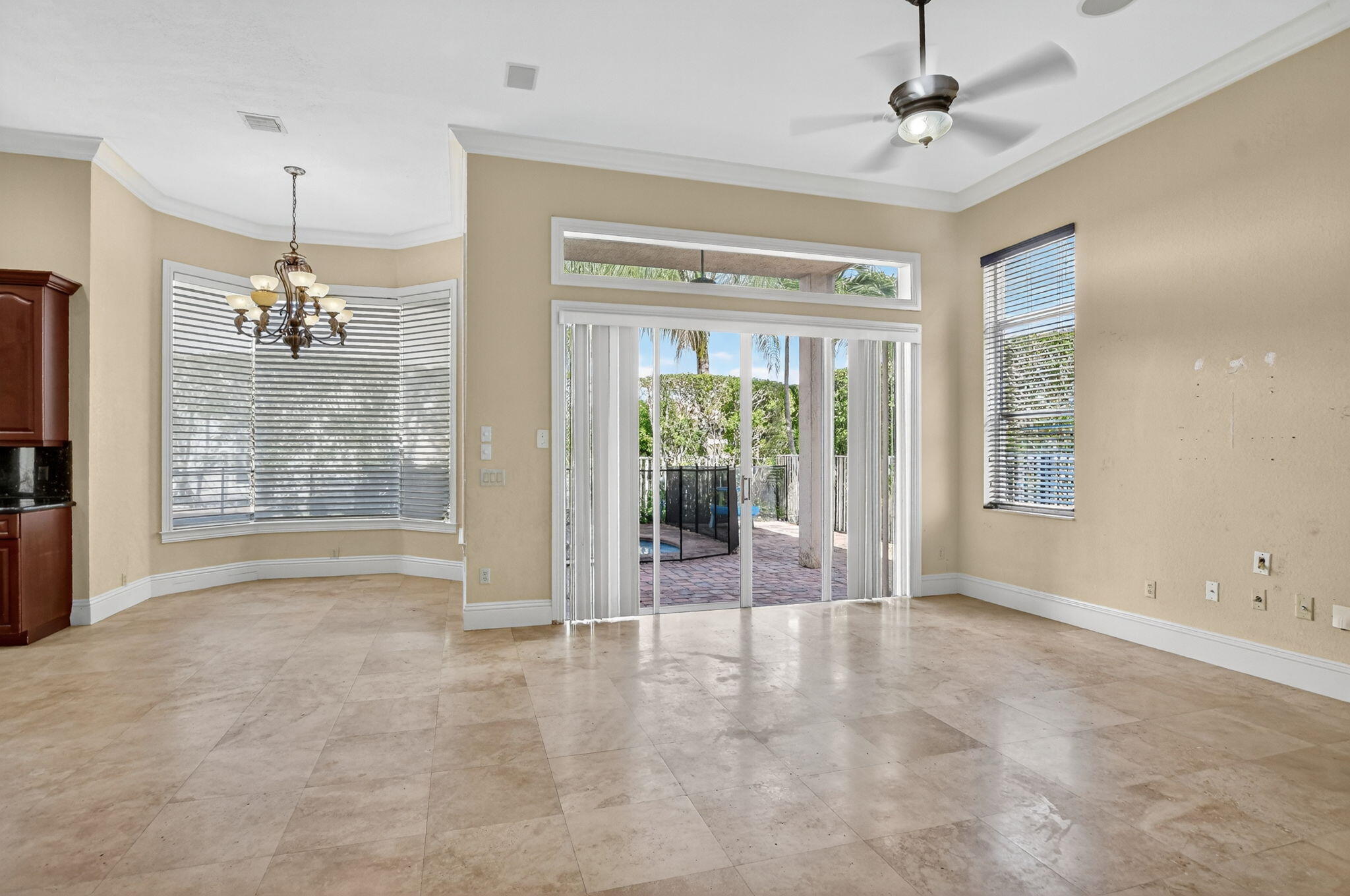 9833 Palma Vista Way Boca Raton, FL 33428 - Photo 16 of 45 a view of an empty room with glass door