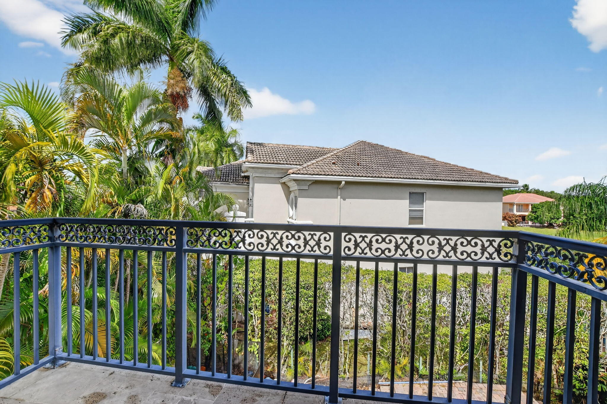 9833 Palma Vista Way Boca Raton, FL 33428 - Photo 30 of 45 a view of a brick house with a large window