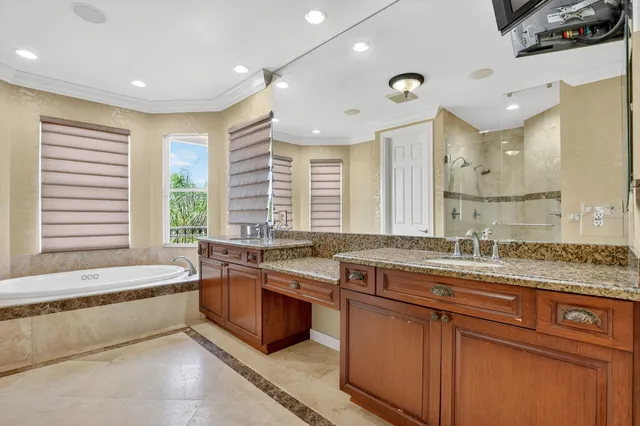 a bathroom with a shower and a glass door