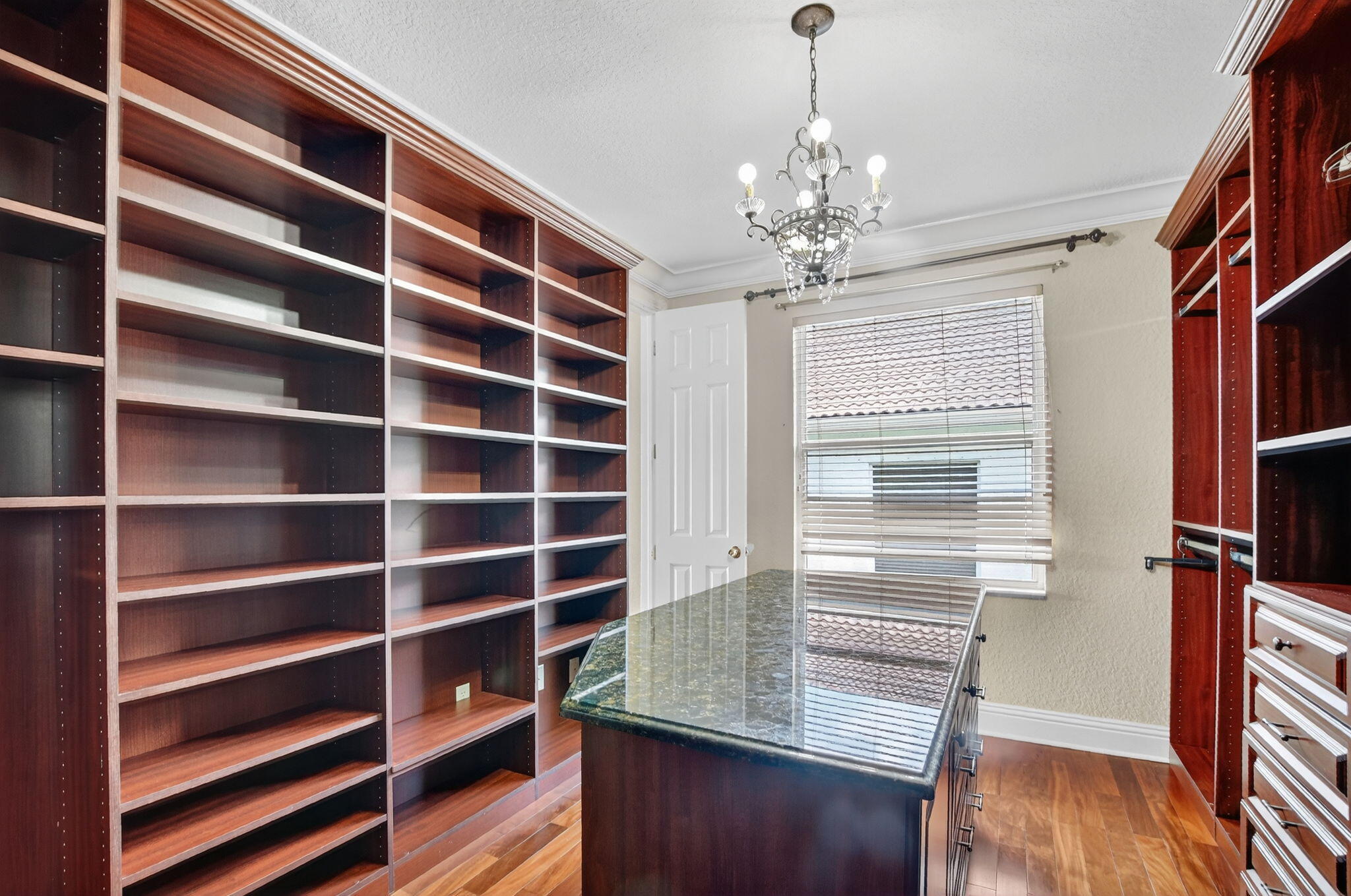 9833 Palma Vista Way Boca Raton, FL 33428 - Photo 36 of 45 a view of walk in closet with empty racks
