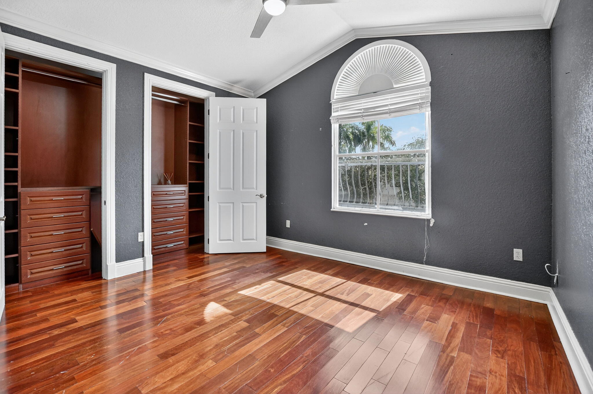 9833 Palma Vista Way Boca Raton, FL 33428 - Photo 38 of 45 wooden floor in an empty room with a window