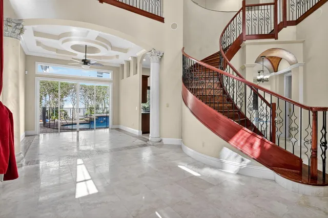 a view of entryway and hall with wooden floor