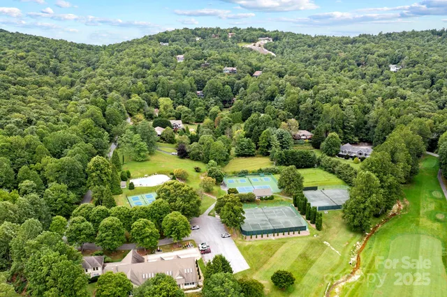 a view of a garden with a building in the background