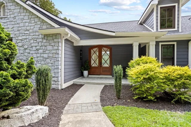 a front view of a house with garden