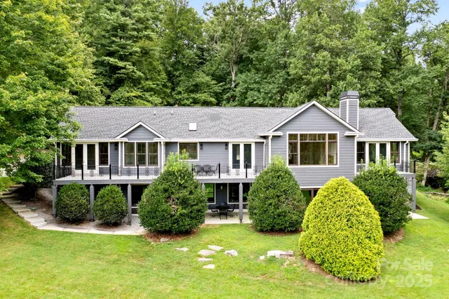 a view of a house with a yard and plants