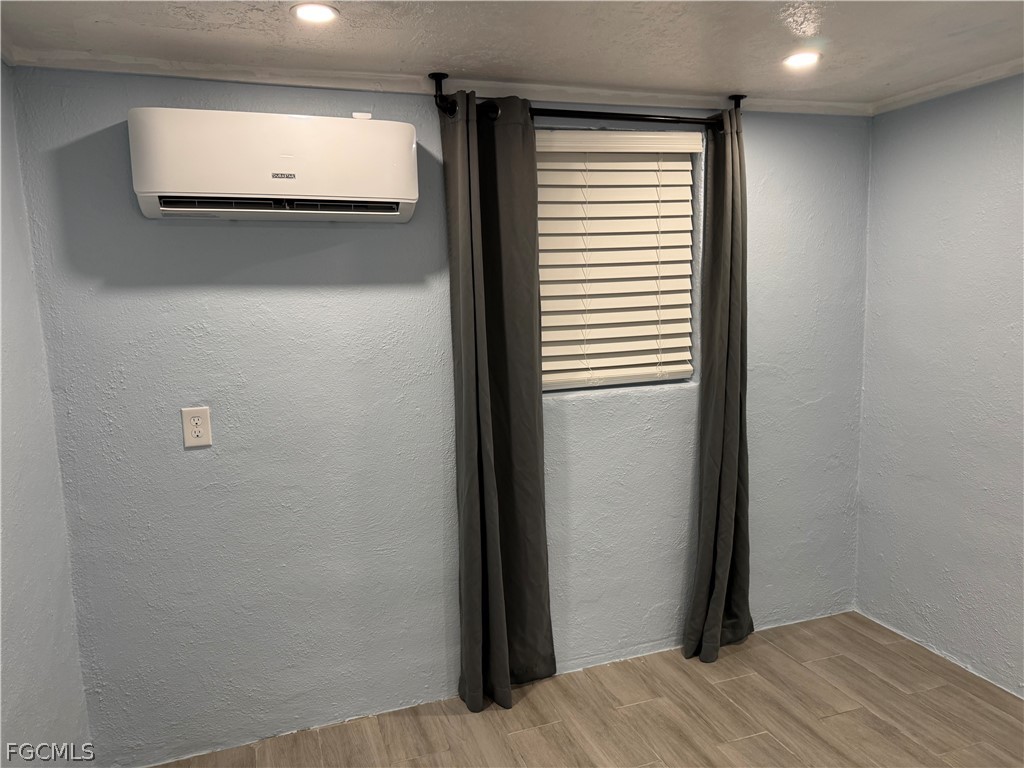 2566 Second Street, Unit A Matlacha, FL 33993 - Photo 3 of 8 a view of a hallway with wooden floor