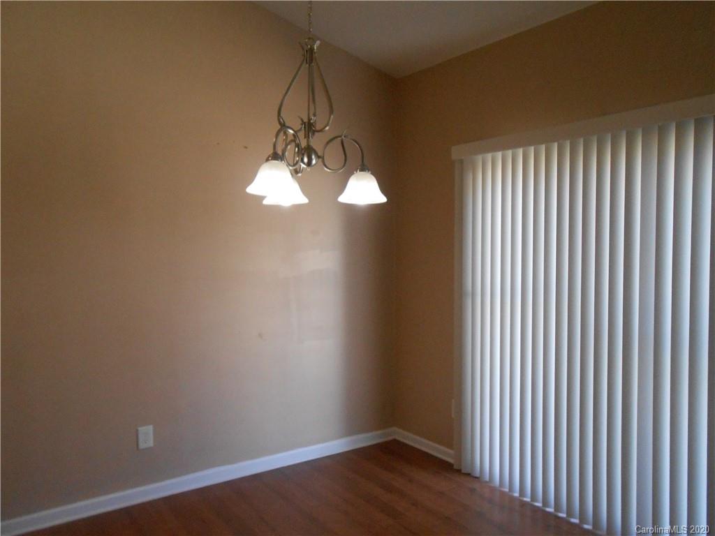 11605 Downy Birch Road Charlotte, NC 28227 - Photo 13 of 21 a view of a chandelier in a room
