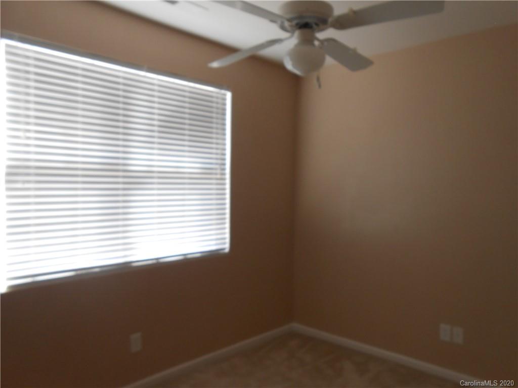 11605 Downy Birch Road Charlotte, NC 28227 - Photo 15 of 21 an empty room with a window