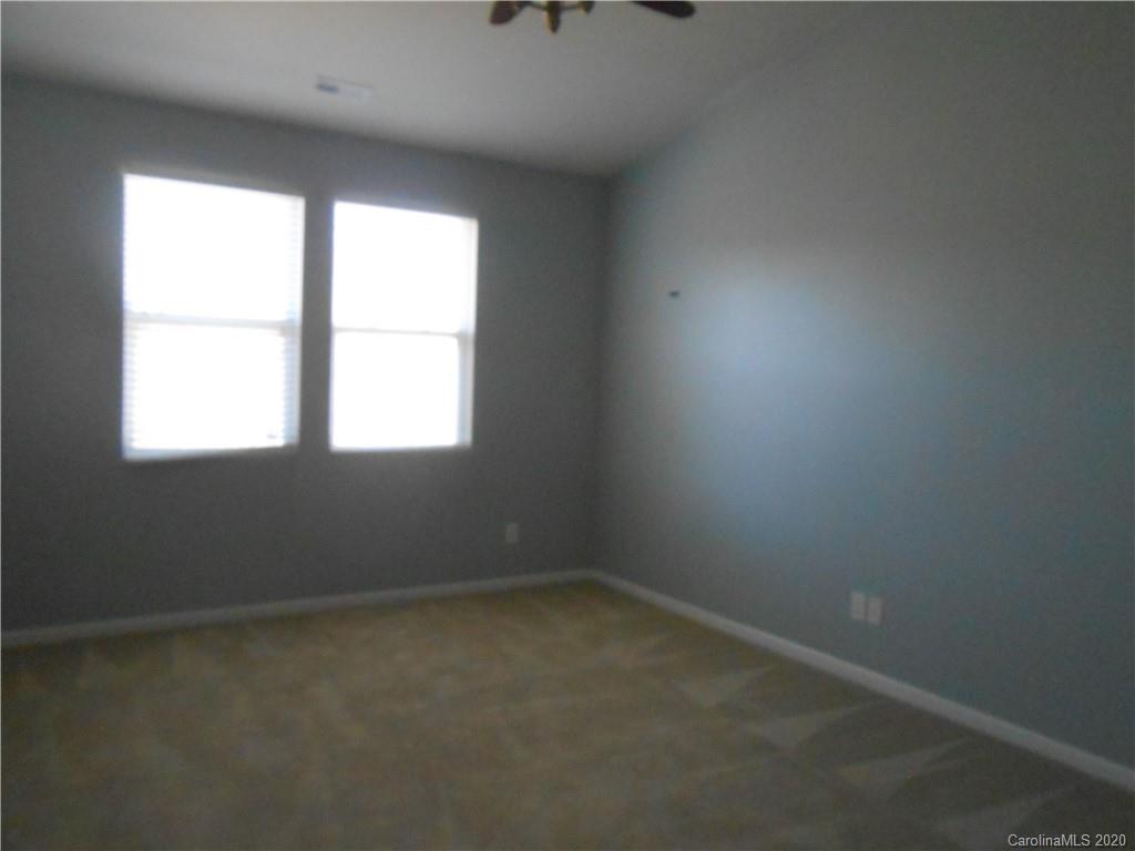 11605 Downy Birch Road Charlotte, NC 28227 - Photo 18 of 21 an empty room with a window