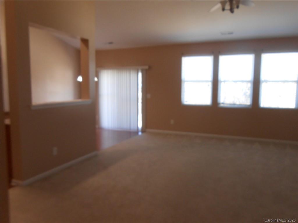 11605 Downy Birch Road Charlotte, NC 28227 - Photo 8 of 21 an empty room with a empty space and windows