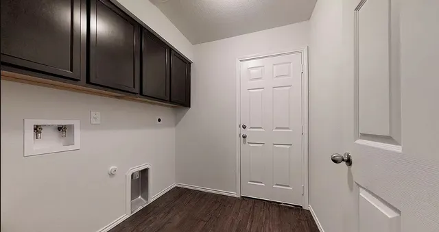 a view of an entryway with wooden floor
