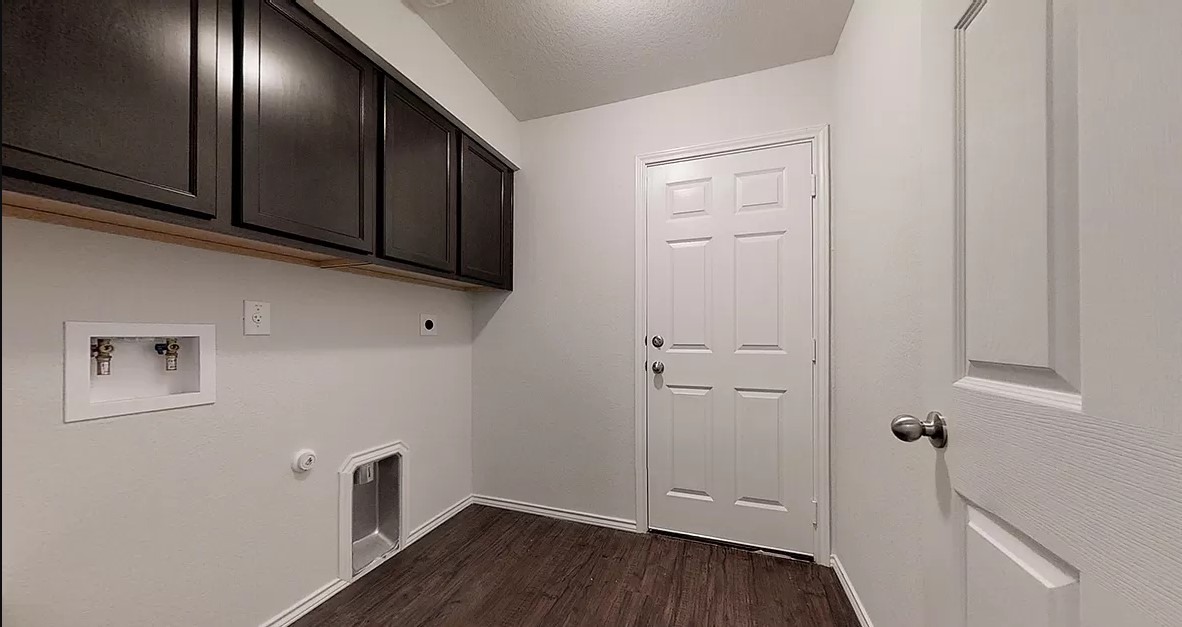 1828 T H Johnson Drive Taylor, TX 76574 - Photo 11 of 11 a view of an entryway with wooden floor