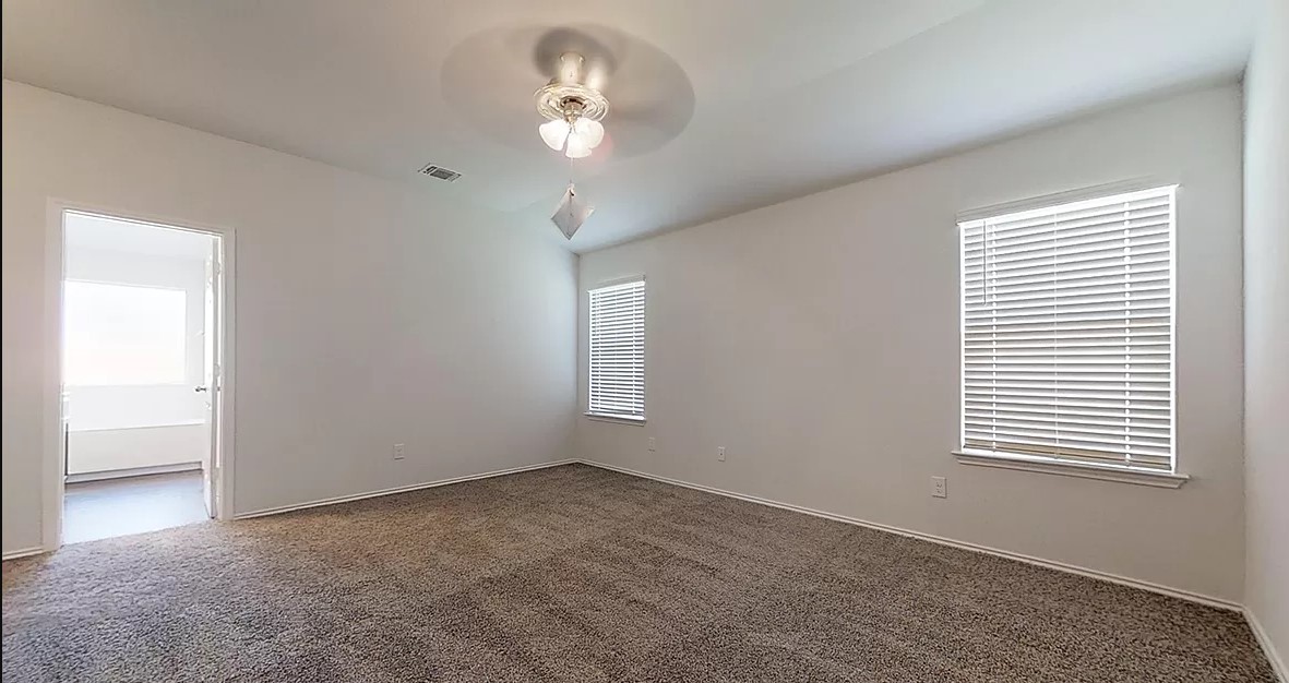 1828 T H Johnson Drive Taylor, TX 76574 - Photo 5 of 11 an empty room with a window