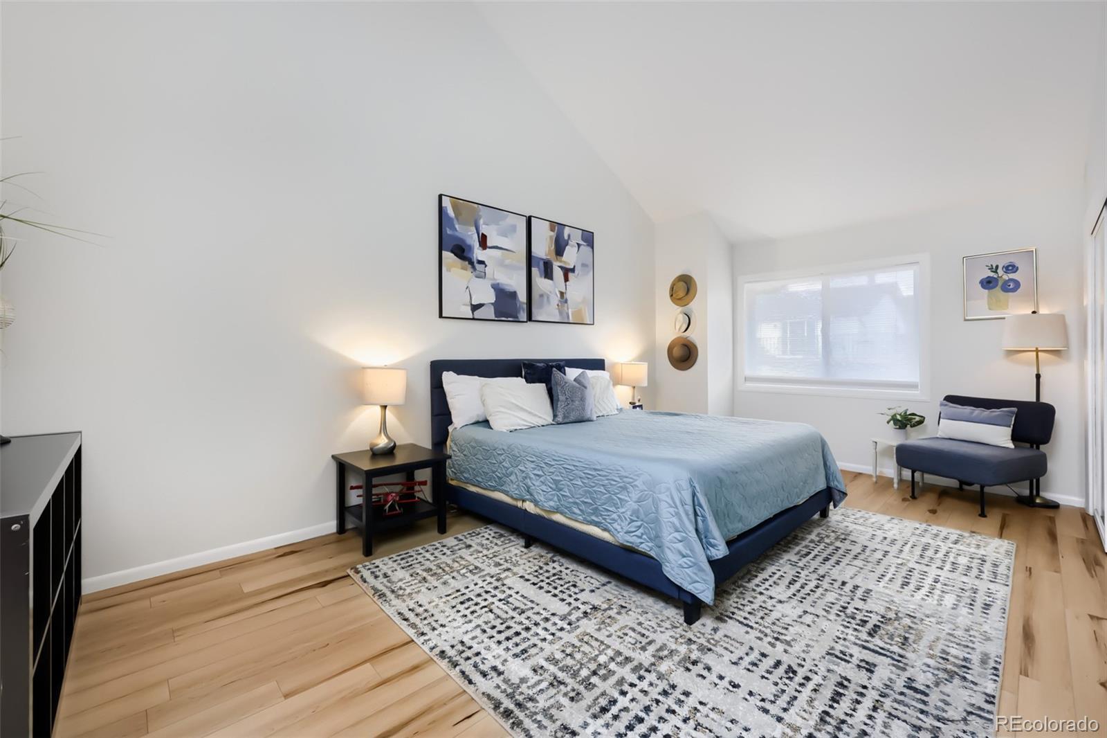 175 Xenon Street Denver, CO 80228 - Photo 14 of 37 a bedroom with a bed and a couch