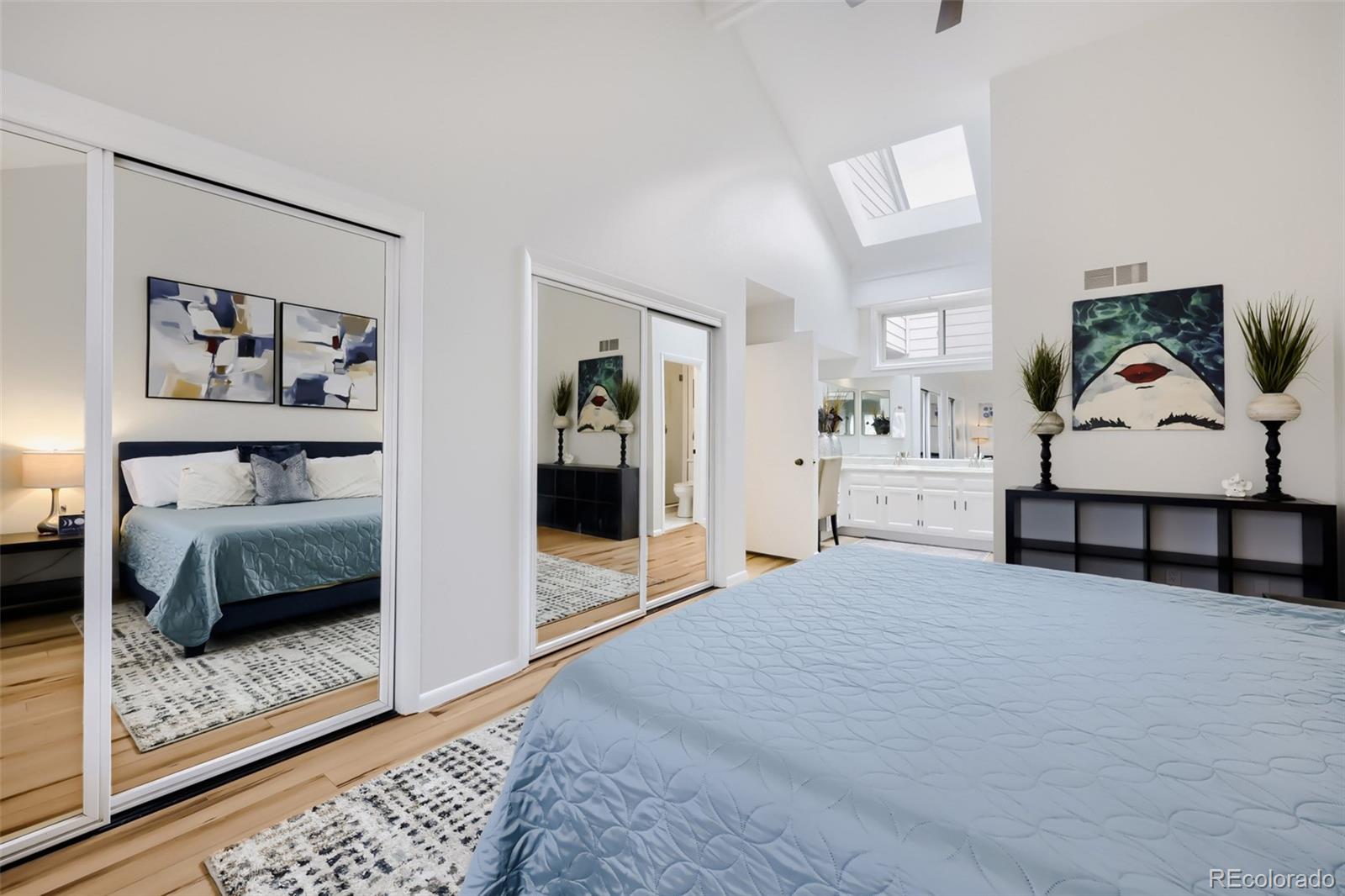 175 Xenon Street Denver, CO 80228 - Photo 15 of 37 a spacious bedroom with a bed and walk in closet