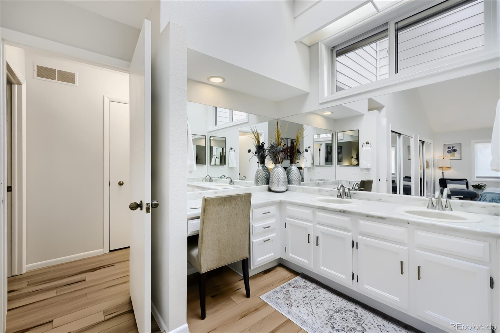 175 Xenon Street Denver, CO 80228 - Photo 16 of 37 a bathroom with a double vanity sink and a mirror