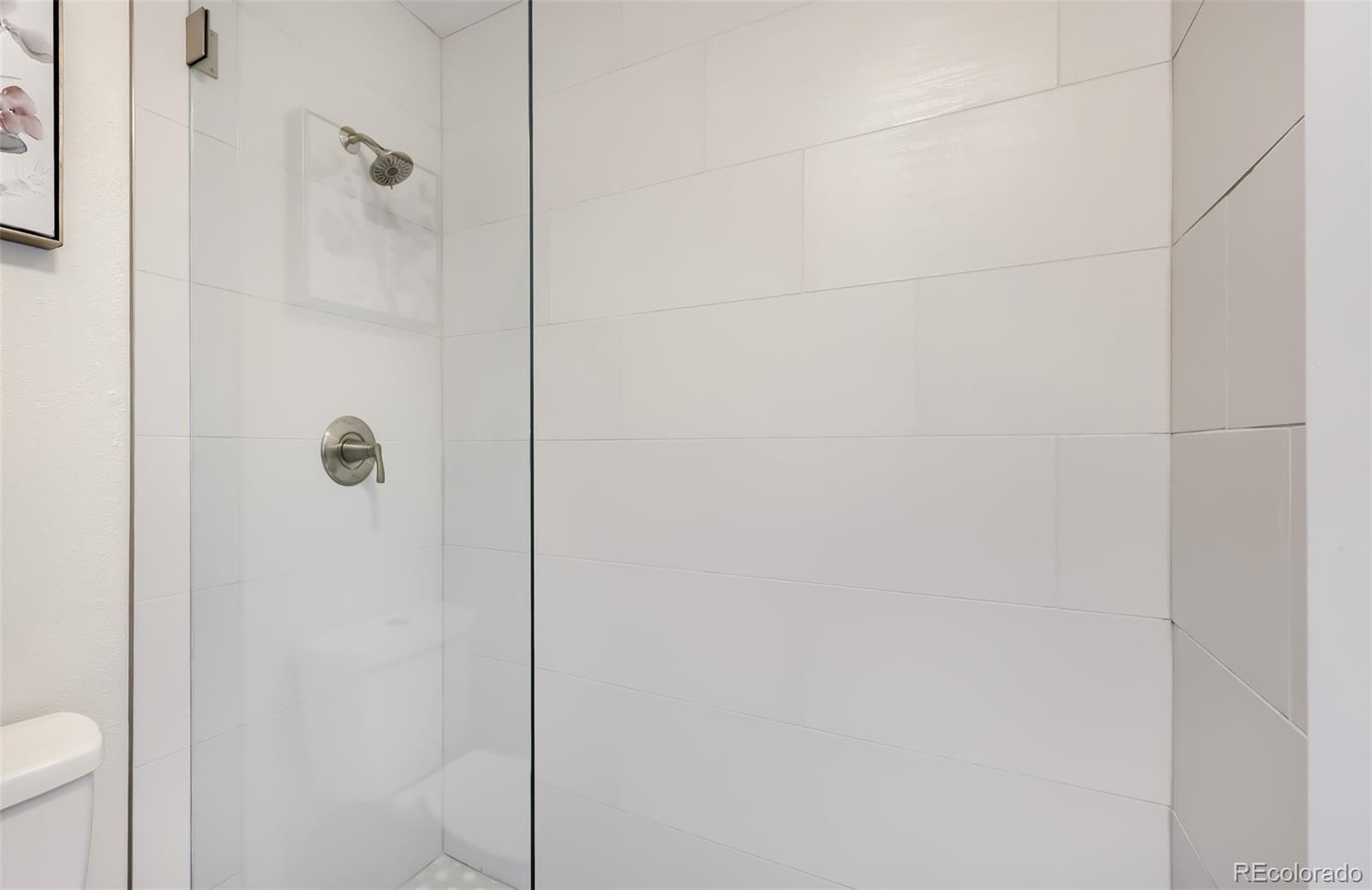 175 Xenon Street Denver, CO 80228 - Photo 17 of 37 a bathroom with a shower