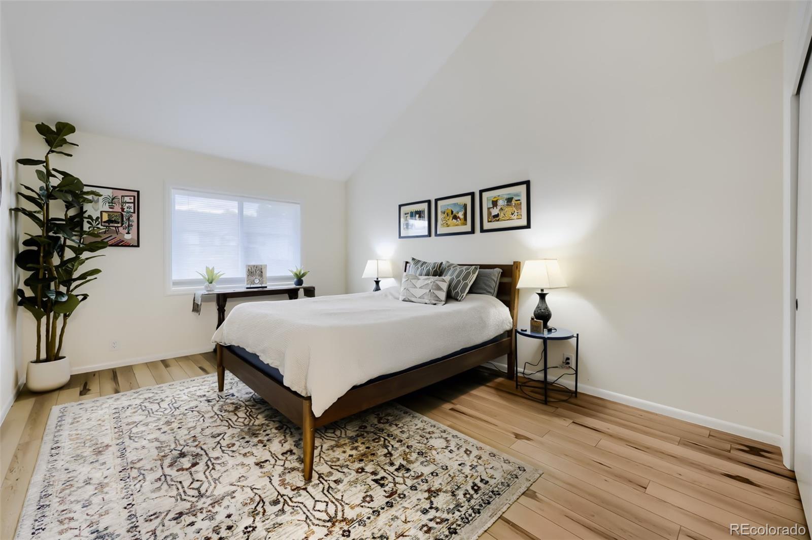 175 Xenon Street Denver, CO 80228 - Photo 18 of 37 a bedroom with a bed and a window