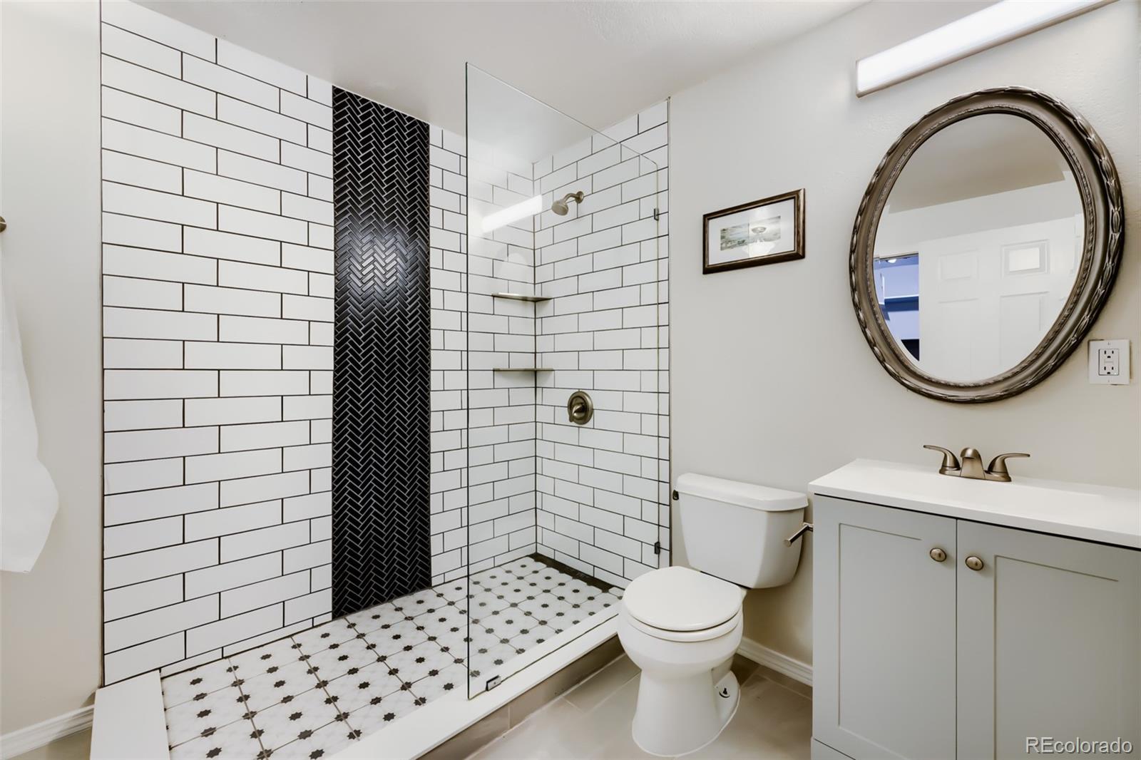 175 Xenon Street Denver, CO 80228 - Photo 25 of 37 a bathroom with a sink toilet and shower