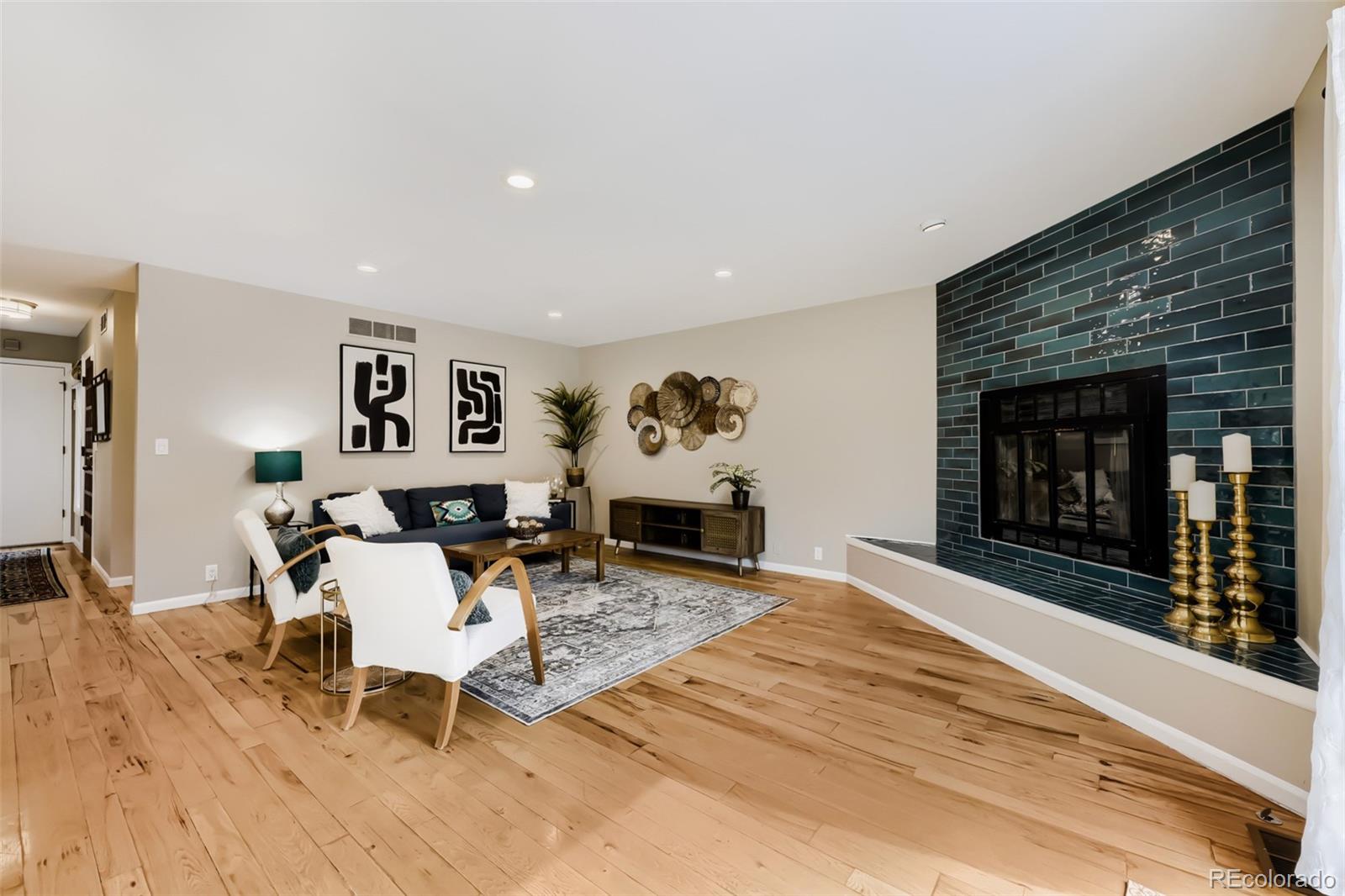 175 Xenon Street Denver, CO 80228 - Photo 6 of 37 a living room with furniture and a fireplace