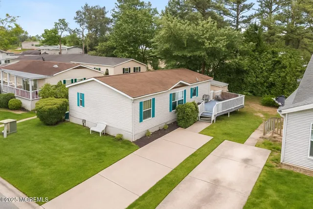 a aerial view of a house with a yard