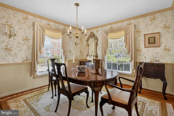 a view of a dining room with furniture and window
