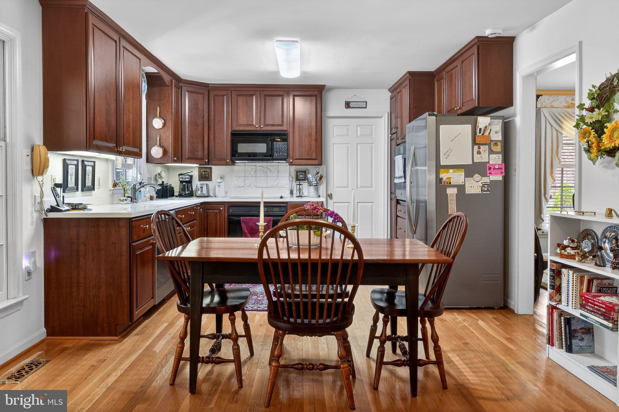 1510 Eton Way Crofton, MD 21114 - Photo 18 of 51 a dining table and chairs in a kitchen