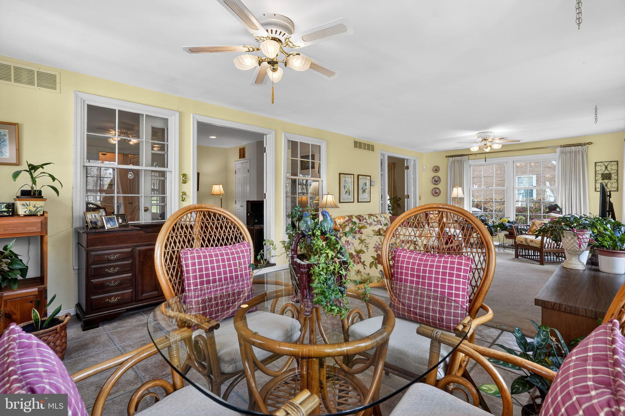 1510 Eton Way Crofton, MD 21114 - Photo 27 of 51 a living room with furniture a rug and a chandelier