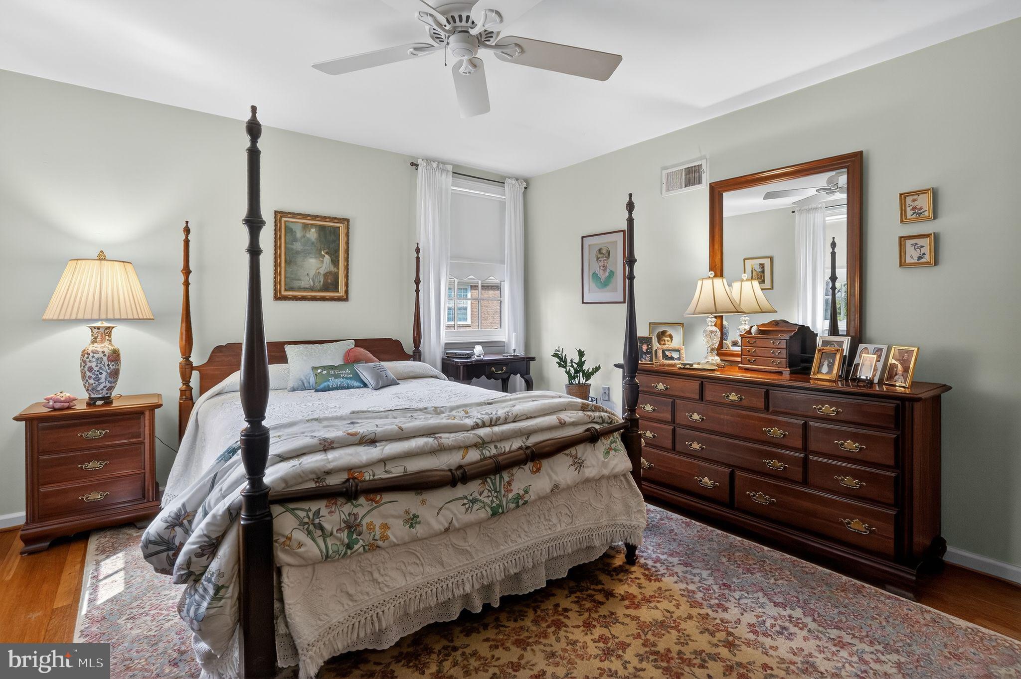 1510 Eton Way Crofton, MD 21114 - Photo 30 of 51 a bedroom with a bed and wooden floor