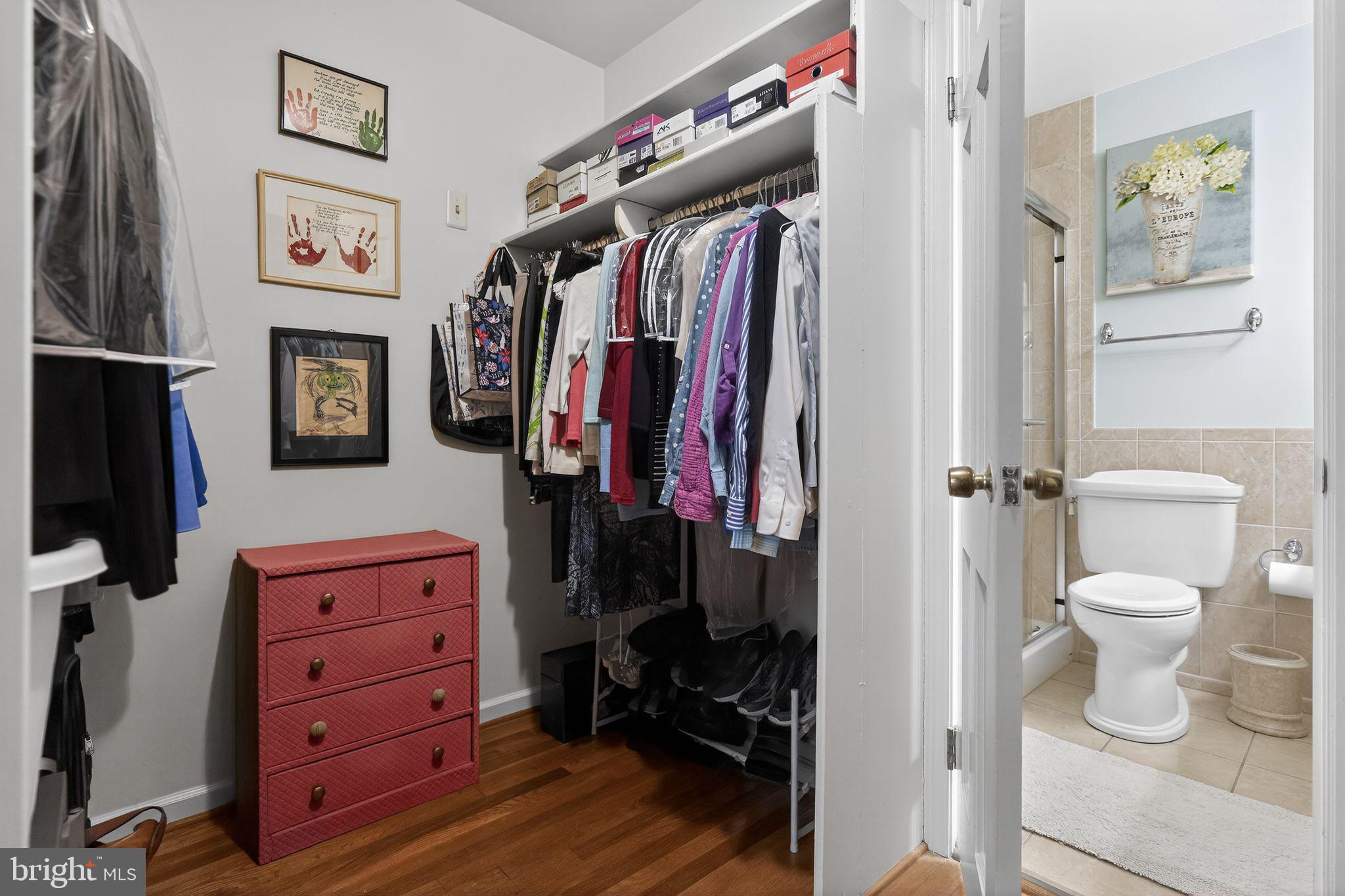 1510 Eton Way Crofton, MD 21114 - Photo 31 of 51 a view of walk in closet with clothes and shoes