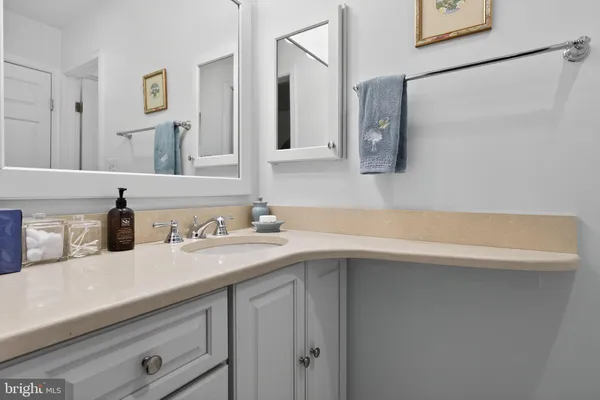 a bathroom with a sink and a mirror