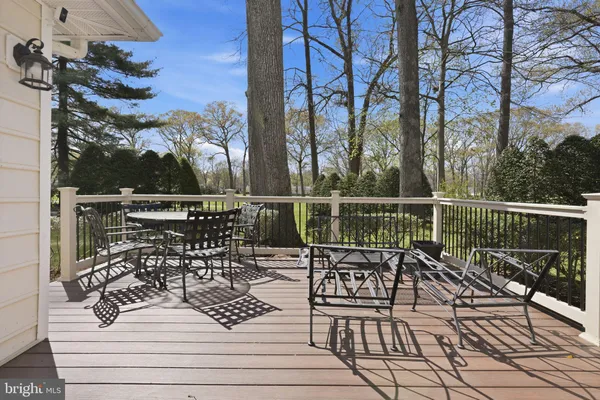 a view of a chairs and table on the deck