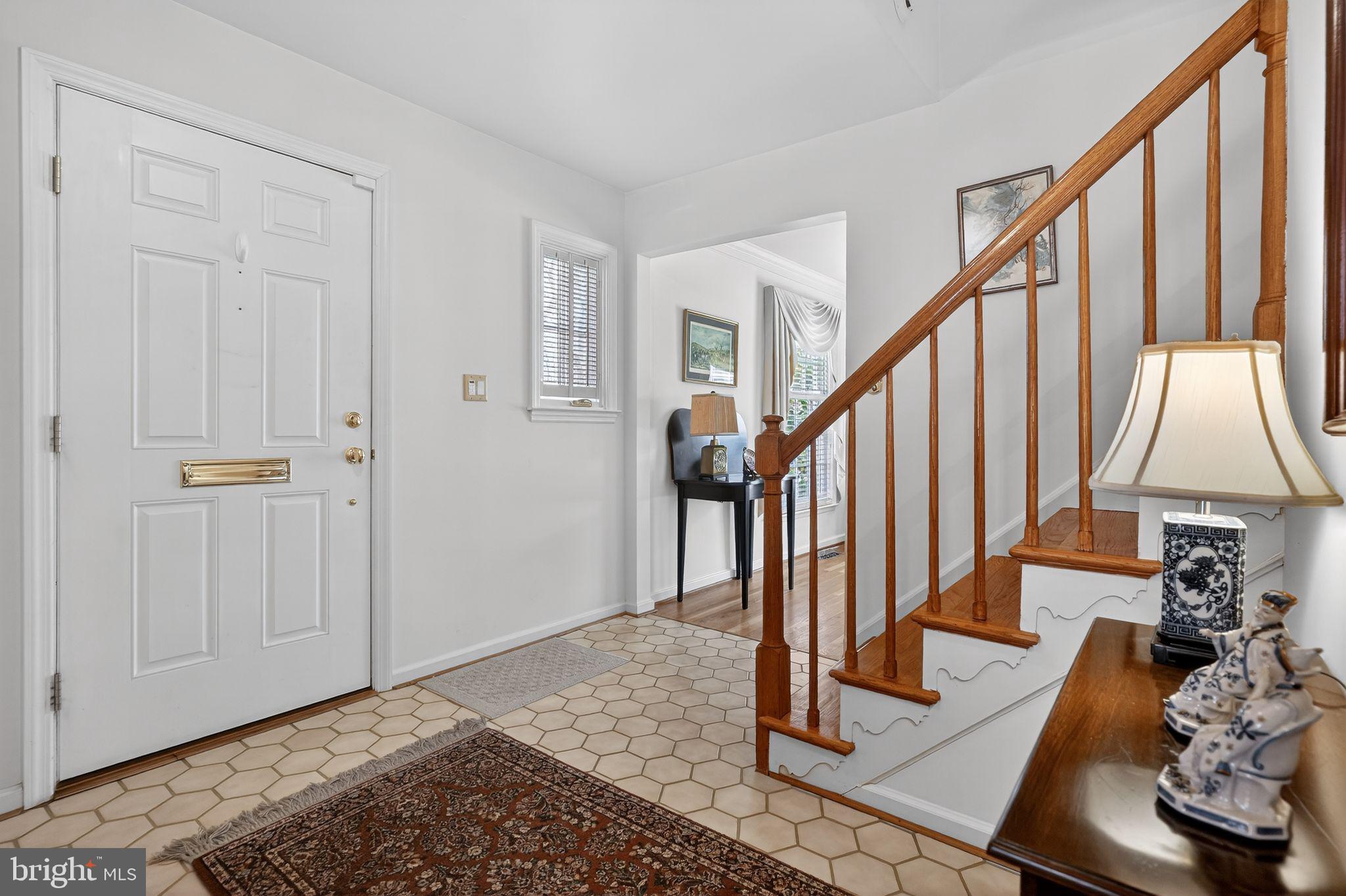 1510 Eton Way Crofton, MD 21114 - Photo 8 of 51 a view of entryway with wooden floor and stairs