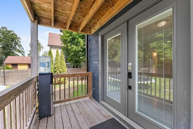a view of a chair and table in the garden
