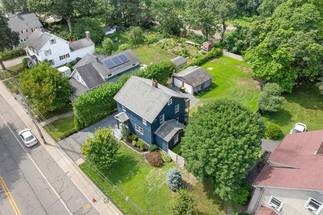 an aerial view of house with yard