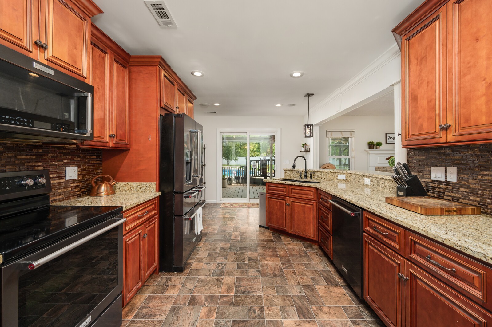 1123 Bramble Trail Murfreesboro, TN 37129 - Photo 12 of 60 a kitchen with stainless steel appliances granite countertop a stove sink and cabinets