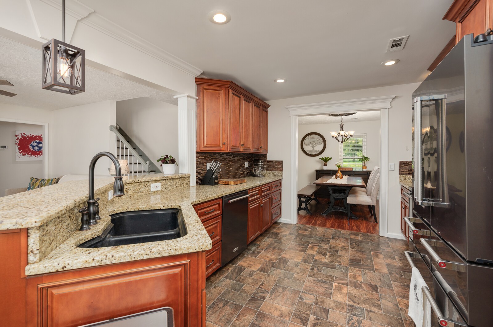 1123 Bramble Trail Murfreesboro, TN 37129 - Photo 13 of 60 a kitchen with a stove a sink and a refrigerator