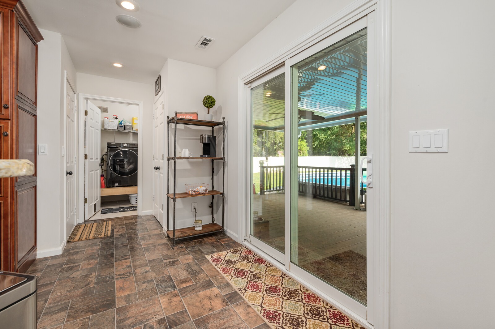 1123 Bramble Trail Murfreesboro, TN 37129 - Photo 19 of 60 a view of a hallway with wooden cabinet and a living room