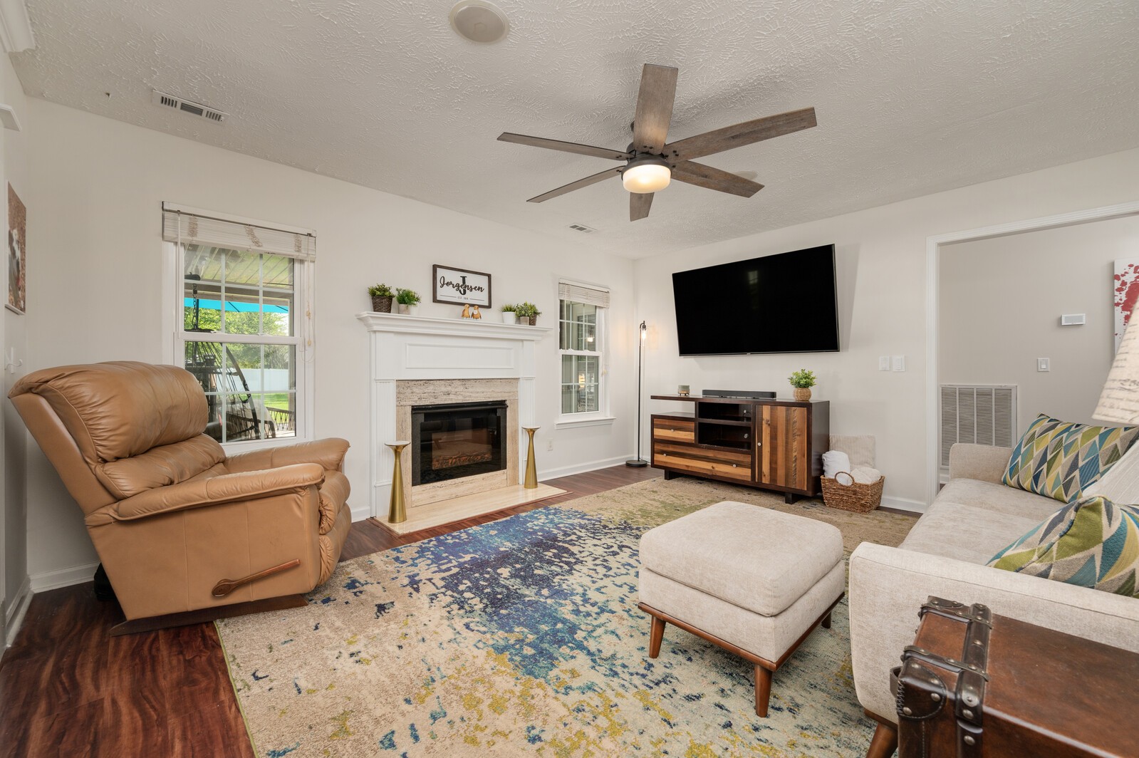 1123 Bramble Trail Murfreesboro, TN 37129 - Photo 20 of 60 a living room with furniture a fireplace and a flat screen tv