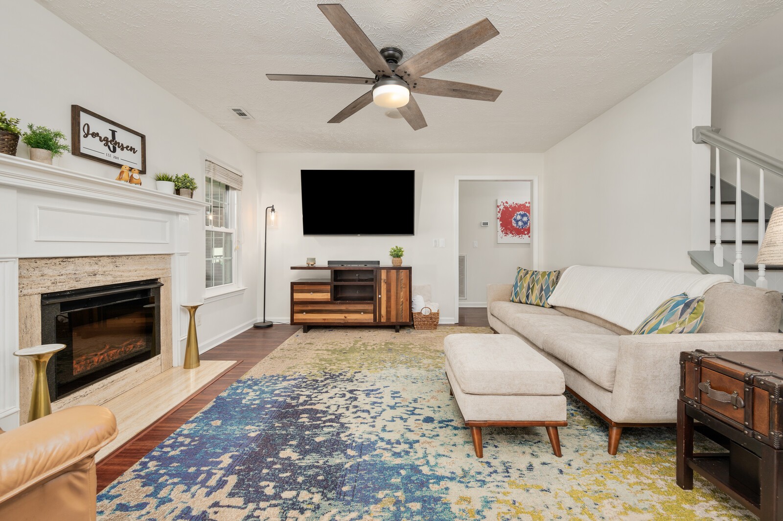 1123 Bramble Trail Murfreesboro, TN 37129 - Photo 22 of 60 a living room with furniture a fireplace and a flat screen tv