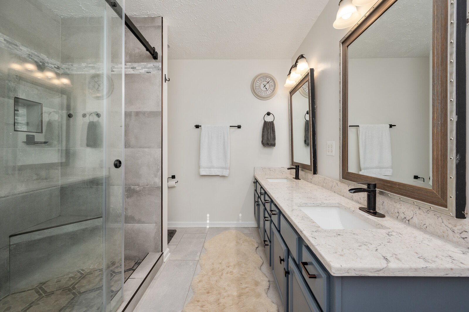 1123 Bramble Trail Murfreesboro, TN 37129 - Photo 29 of 60 a bathroom with a granite countertop sink a mirror and shower