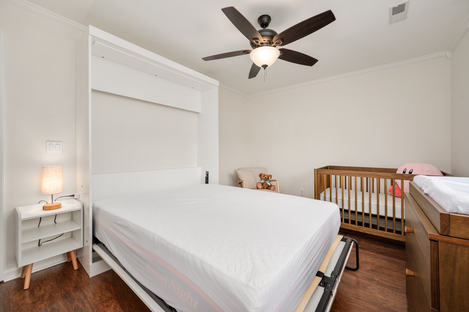 1123 Bramble Trail Murfreesboro, TN 37129 - Photo 33 of 60 a bedroom with a bed and a chandelier