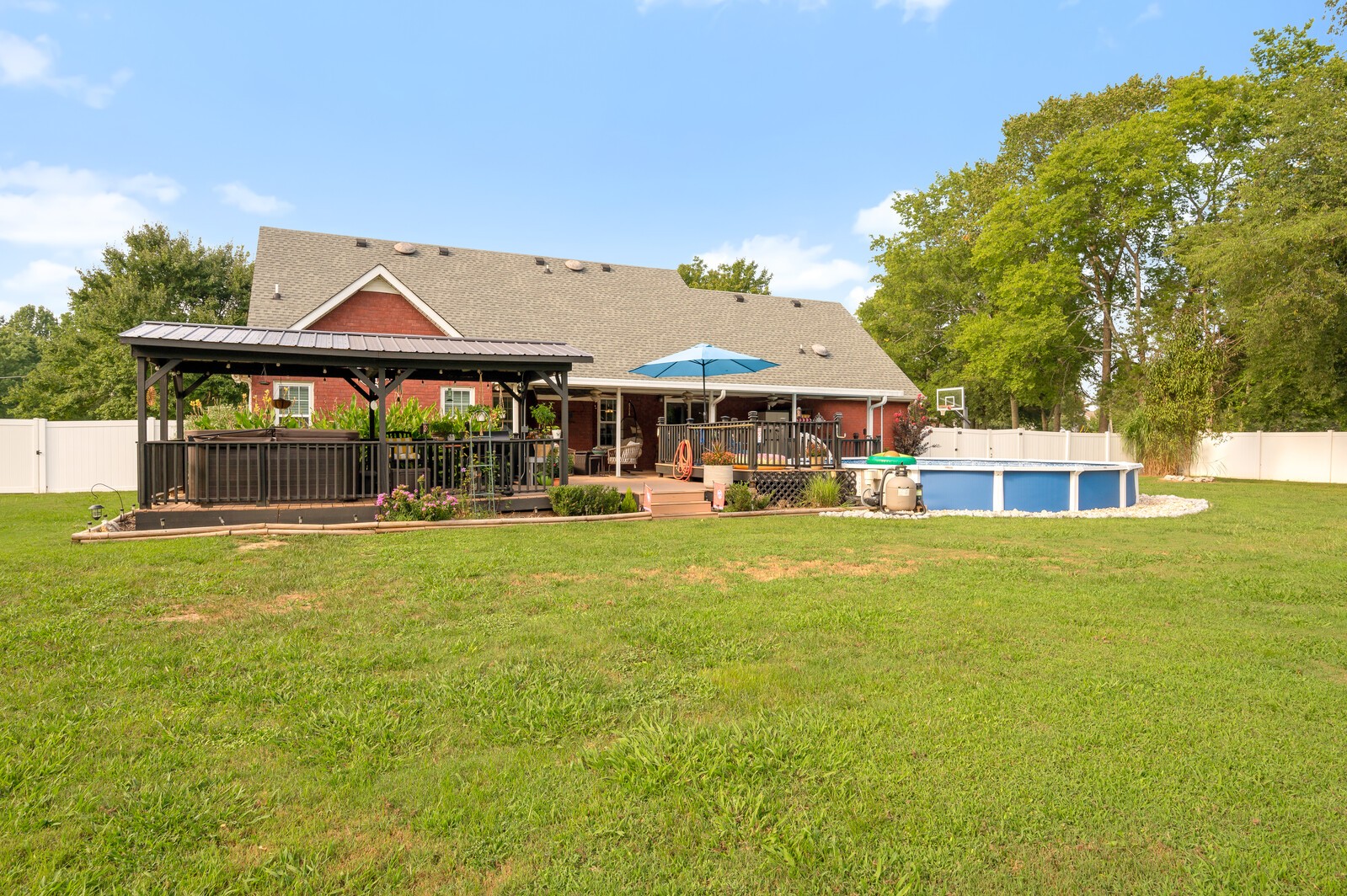 1123 Bramble Trail Murfreesboro, TN 37129 - Photo 54 of 60 a front view of a house with a garden and swimming pool