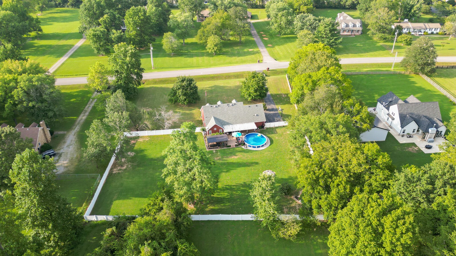 1123 Bramble Trail Murfreesboro, TN 37129 - Photo 57 of 60 a backyard of a building with lots of green space and outdoor seating