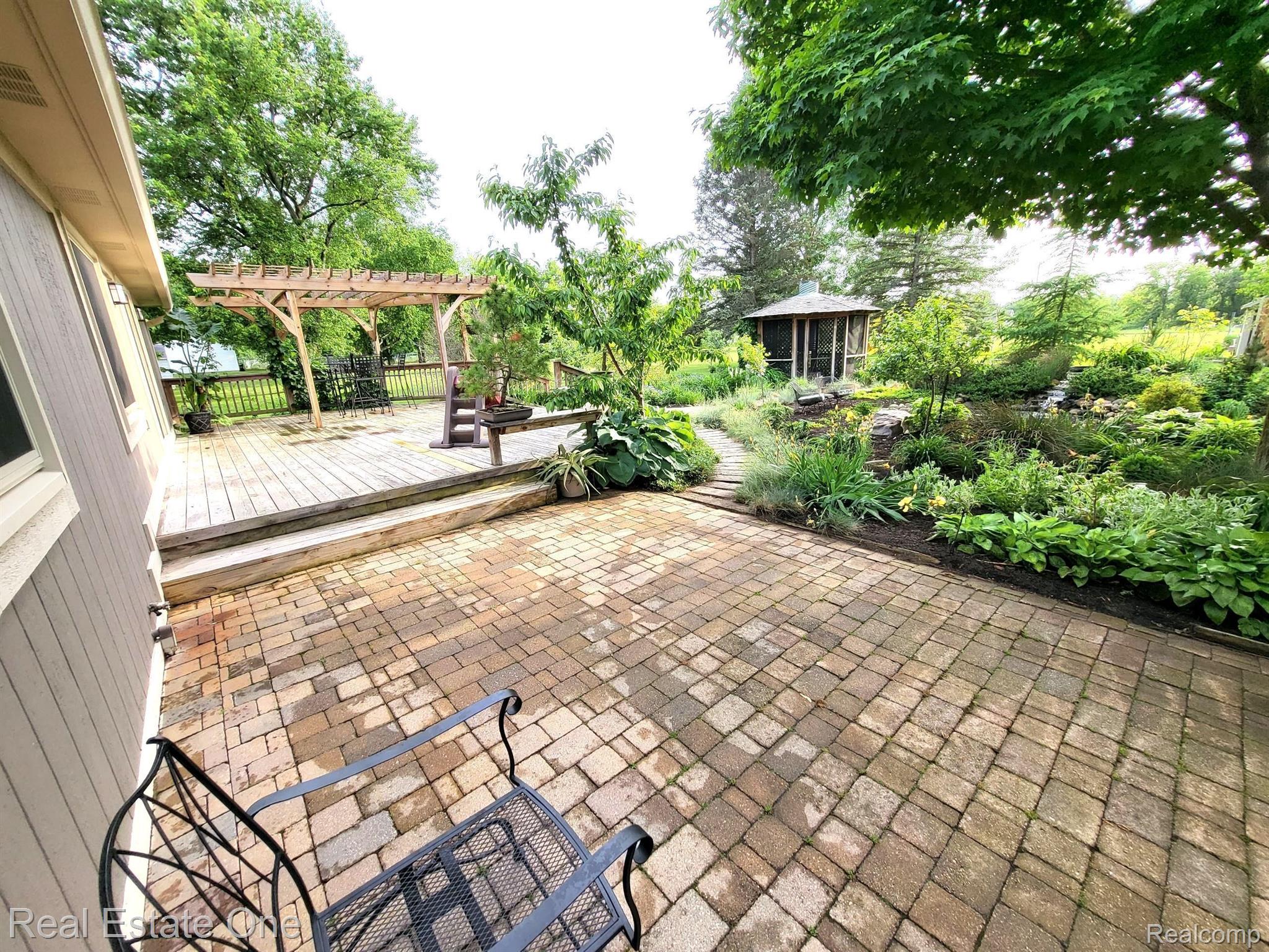 7448 Sharp Road Swartz Creek, MI 48473 - Photo 46 of 49 Brick paver patio off main deck