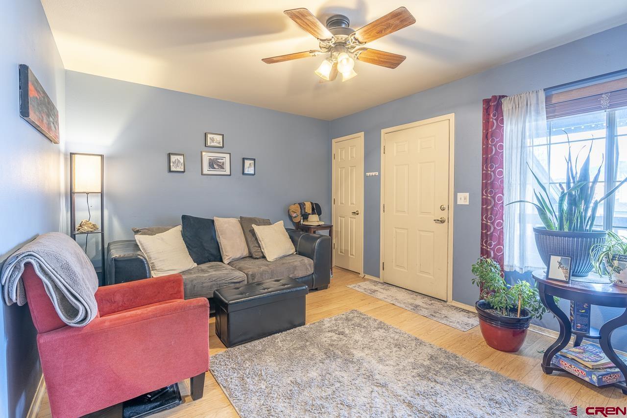 1100 Goeglein Gulch Road, Unit 222 Durango, CO 81301 - Photo 6 of 32 a living room with furniture potted plant and a window