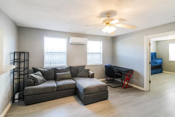a living room with furniture and a window