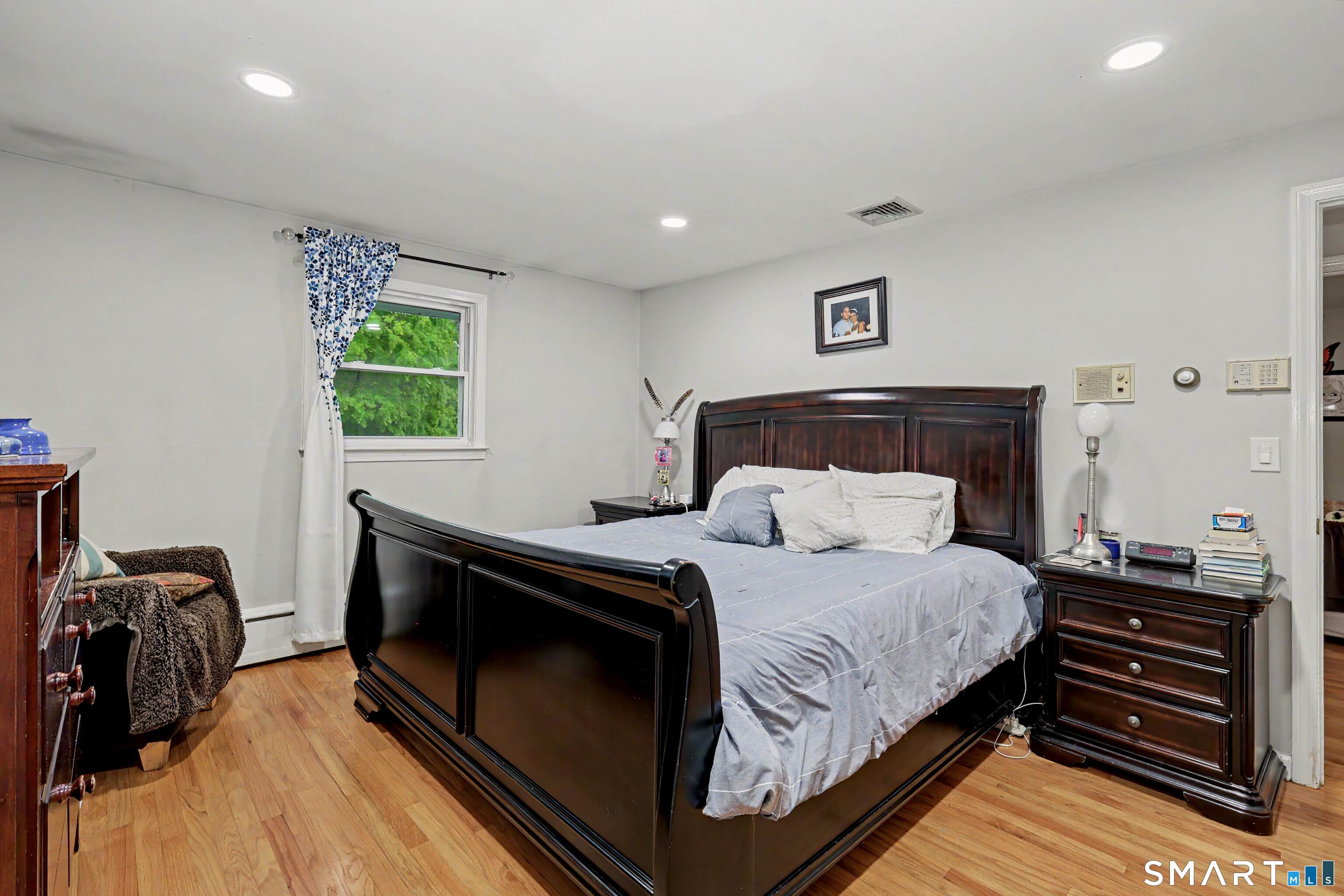44 Haverhill Road Trumbull, CT 06611 - Photo 13 of 32 a bedroom with a bed and a dresser