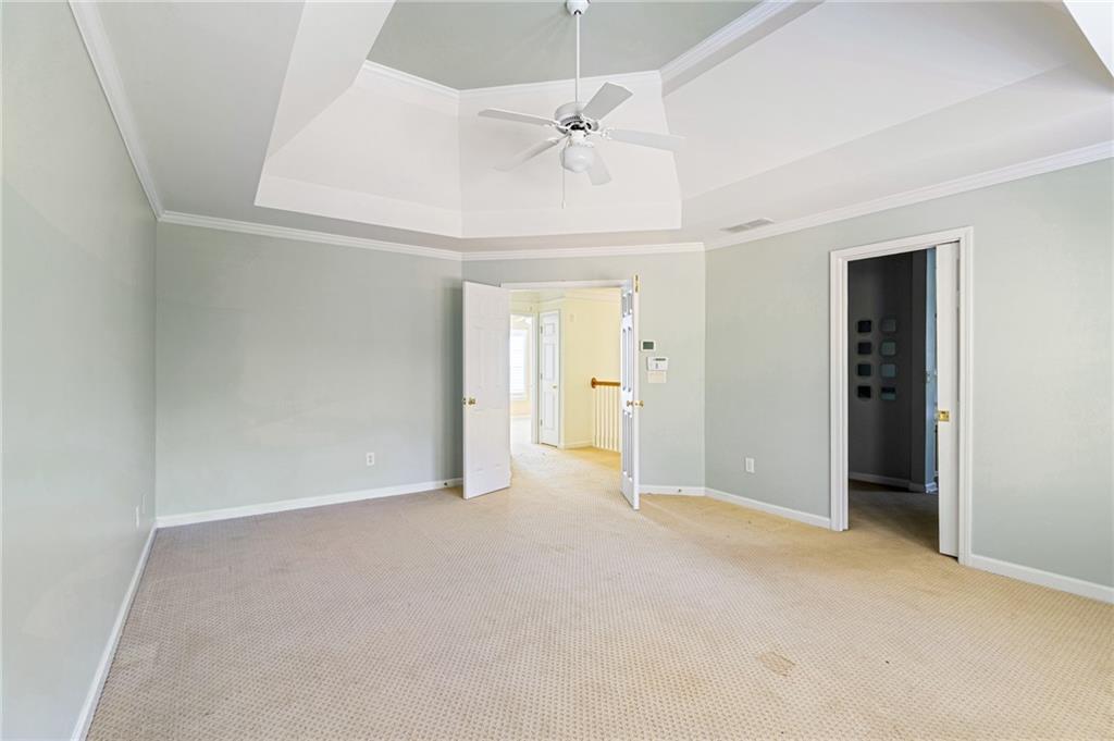 1355 Chattahoochee Run Drive Suwanee, GA 30024 - Photo 18 of 57 a view of an empty room with a ceiling fan