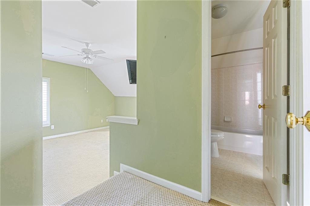 1355 Chattahoochee Run Drive Suwanee, GA 30024 - Photo 24 of 57 a bathroom with a glass shower door